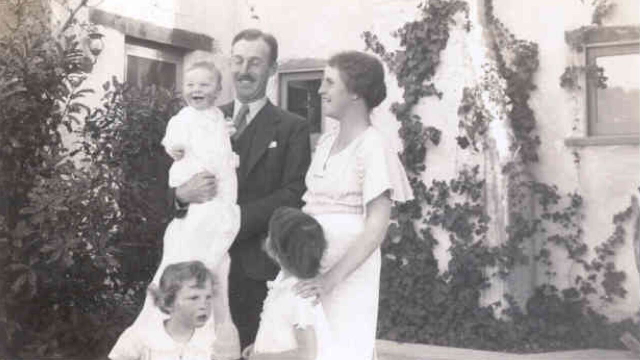 Black and white photograph of man, woman, and three children